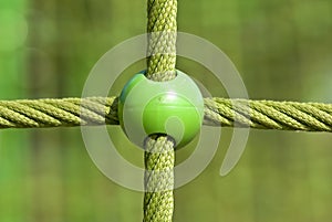 Children`s playground with green balls and cords