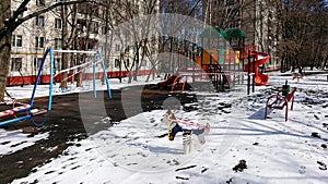 Children`s playground in Moscow with equipment in signal tape to avoid its usage during COVD-19 quarantine photo