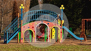 Children`s playground in the park in autumn