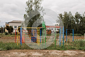 Children`s playground in park on a green meadow