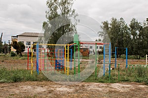 Children`s playground in park on a green meadow