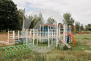 Children`s playground in park on a green meadow