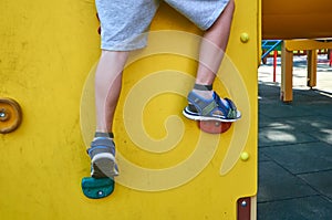 children& x27;s playground in a public park, kid& x27;s entertainment and recreation, mountaineering training, with kid& x27;s leg