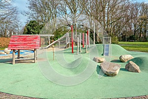 Children`s playground with a rubber floor.