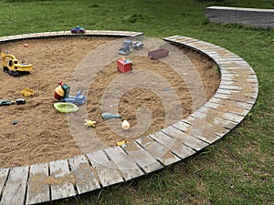 Children`s playground with sandbox and toys, relaxation park. Familie place.