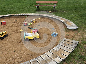 Children`s playground with sandbox and toys, relaxation park. Familie place.