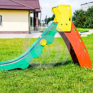 Children's playground. Swing, carousel and slide photo