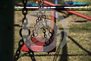 Children`s playground swing perspective shot