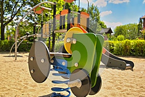 Children`s playground with a swing toy.