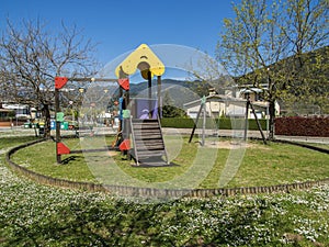 Children`s playground with swings and slide
