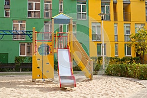 Children`s playground in the yard colorful houses