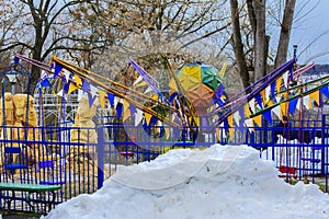 Children`s playgrounds and children`s rides in the winter