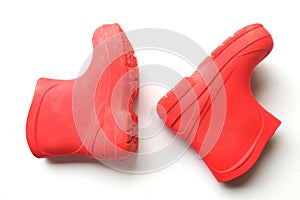Children`s red rubber boots isolated on white background. rainy weather