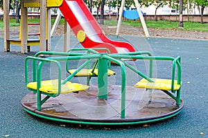 Children`s revolving carousel in the park. Children`s playground in the public park. Russia. Autumn.