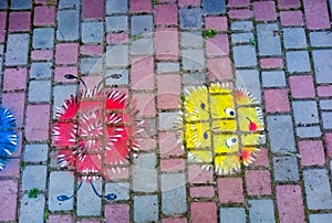 Children`s rhymes drawn drawings on paving slabs photo