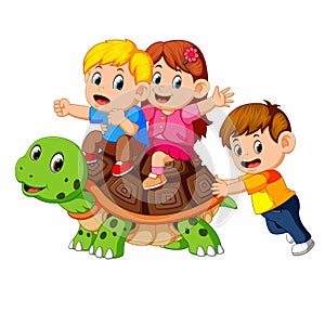 Children`s riding giant turtle