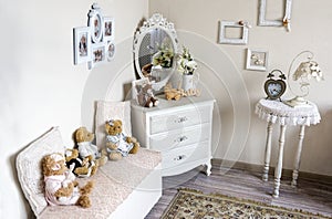 Children`s room with chest of drawers plush toy bears, mirror