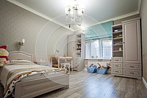 Children`s room. Interior with wooden bed, wardrobe and floor