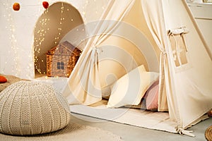 Children's room with play tent teepee and pillows close up