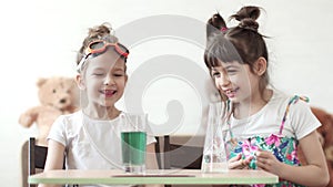 Children`s science. Children conduct a chemical experiment at home. mixing of iodine and hydrogen peroxide