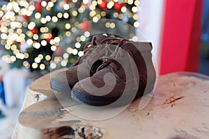 Children's shoes on a background of lights