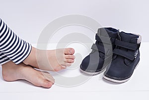 Children`s shoes and feet