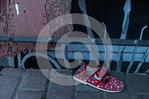 children's shoes in the ruins, the war