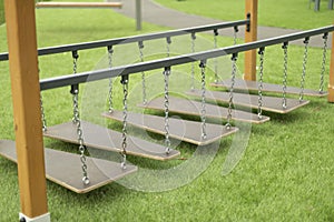 Children`s shroud. Obstacle bar in children`s area. Feet on chains