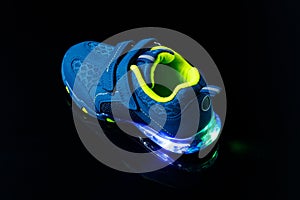 Children`s sneaker shoe with led light illumination