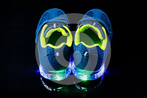 Children`s sneaker shoes with led light illumination