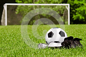 Children's soccer gear on field