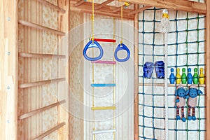 Children`s sports area. Baby wall bars. Ladders, ropes, sports rings