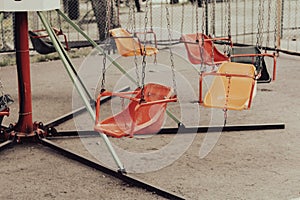 Children's swing on a playground in the park. Selective focus