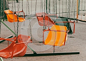 Children's swing on a playground in the park. Selective focus