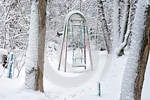 Children`s swings in winter park