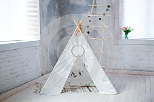 Children`s tent with cushions at the window in the studio, children`s room, dream catcher