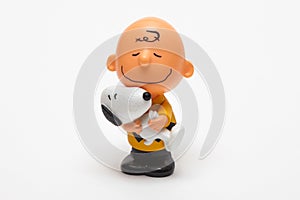 Children`s toy Boy with Snoopy dog on a white background