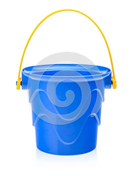 Children's toy bucket in blue on a white background. Toys for playing in the sandbox or on the beach. Children's