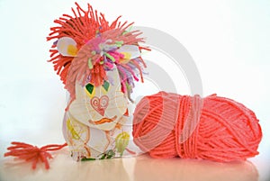 Children's toy lion hack with wool clew on white