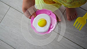 Children`s toy - scrambled eggs in the hands