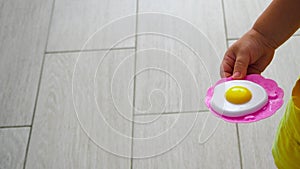 Children`s toy - scrambled eggs in the hands