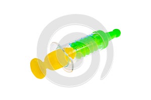 Children`s toy syringe. On a white background, isolated