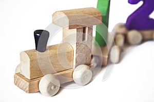 Children`s toy wooden locomotive with colorful numbers, beautiful educational toy for a child. Wooden Toy Train. Wooden