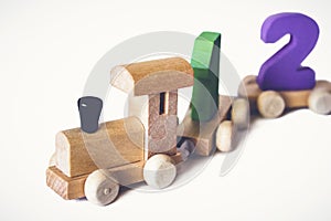 Children`s toy wooden locomotive with colorful numbers, beautiful educational toy for a child. Wooden Toy Train. Wooden