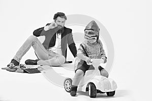 Children`s toy world. small boy driver or pilot and bearded father