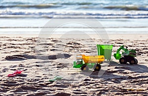 Children`s toys on the beach