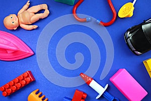 Children`s toys lie on a blue background