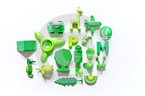 Children`s toys are a lot of color green.Flat lay Copy Space