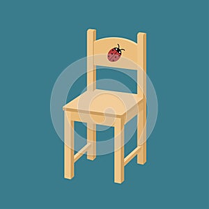 Children`s wooden chair with ladybug. Isolated on blue background.