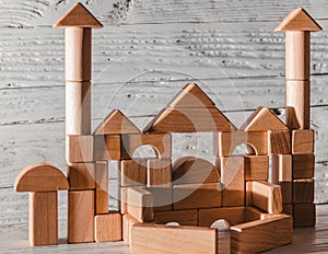 Children`s wooden designer from blocks of a different form